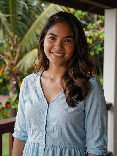 Maria Clara, 25, Filipina woman in a blue blouse on a tropical veranda in Cebu