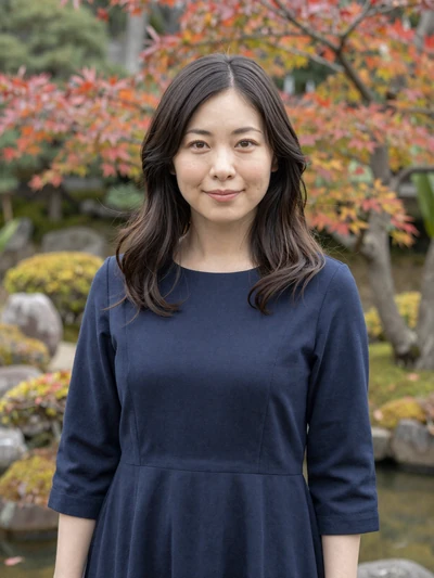 Aika, 32, Japanese woman in a navy dress in a traditional Japanese garden in Osaka