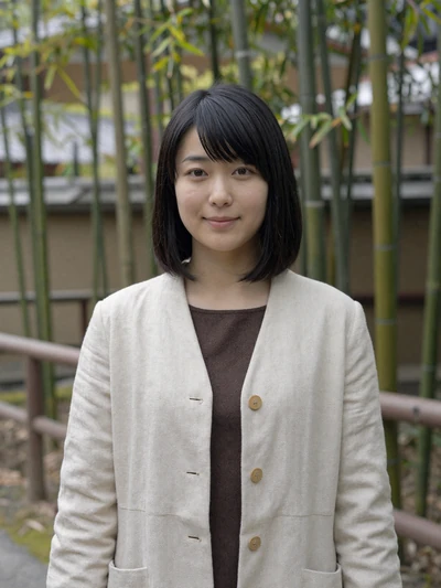 Sakura, 31, verified Japanese woman in cream jacket at a bamboo garden in Kyoto